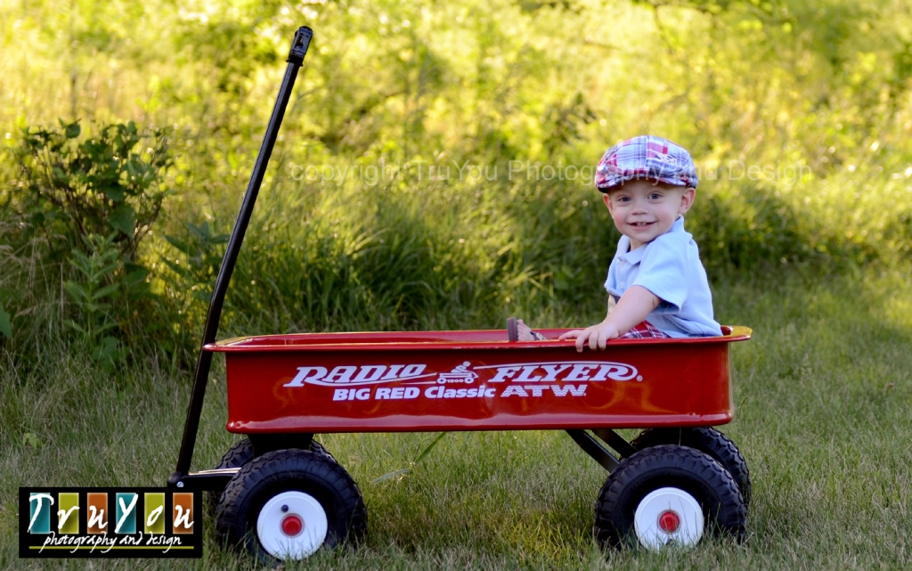 Little Guy in a Red Wagon